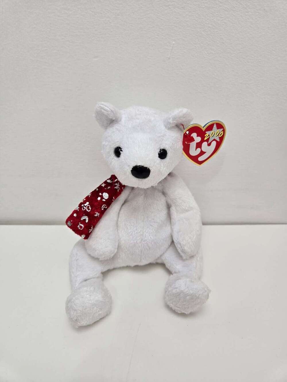 Ty Beanie Baby “2000 Holiday Teddy” the White Holiday Bear wearing Red Scarf
